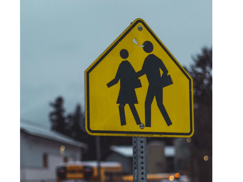 Children crossing road sign. Yellow diamond background. Traffic