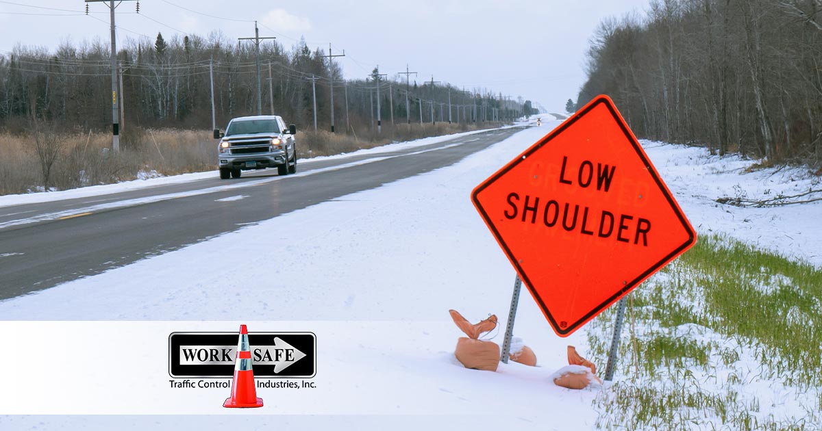 Low shoulder sign beside a road