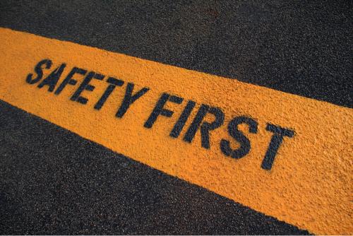 Safety first sign on caution strip