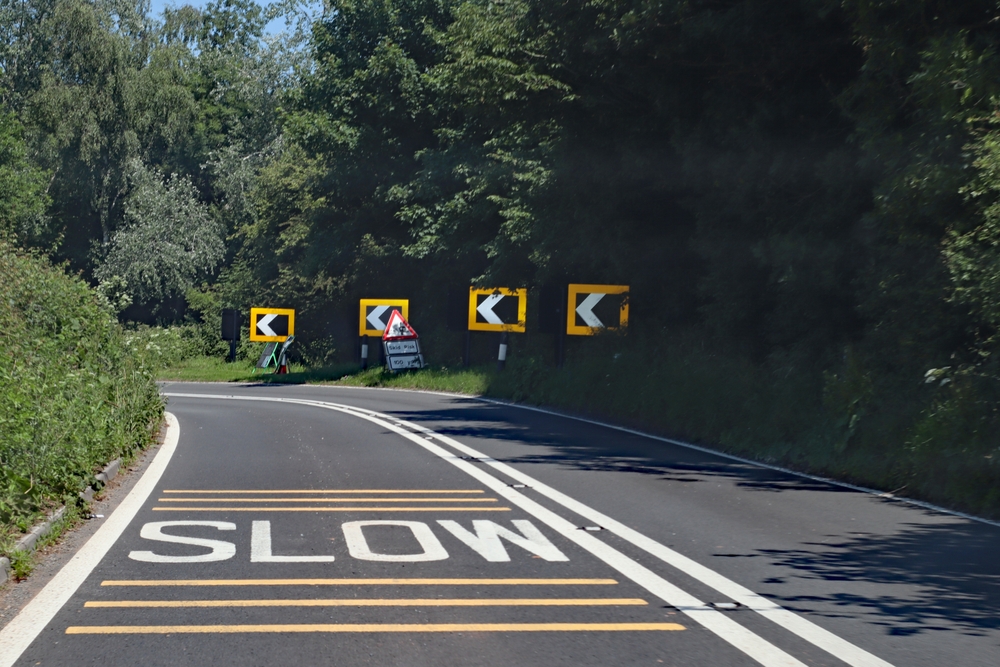 Black,and,white,chevrons,,a,double,white,line,and, hazard marker signs